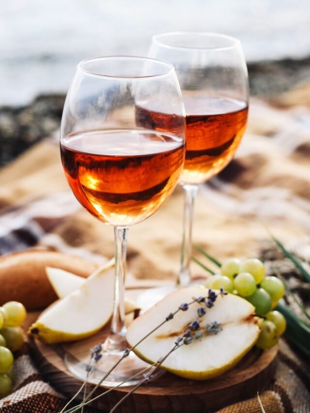 two-glasses-of-wine-and-summer-fruits-on-the-beach-royalty-free-image-1635272439
